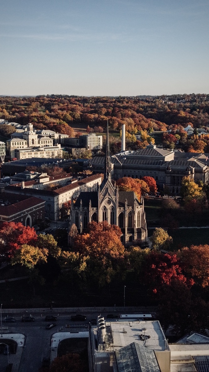 Pittsburgh campus buildings among fall foliage, seen from above